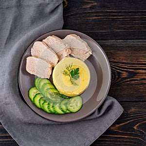 Plate with mashed potatoes, boiled meat and cucumber salad. Proper healthy diet for weight loss. Convalescence diet.