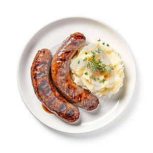 A plate of mashed potatoes and sausages