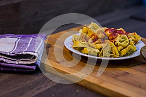 Plate of meat ravioli with tomato