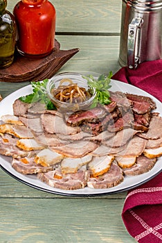 Plate with meat slices, different types of meat