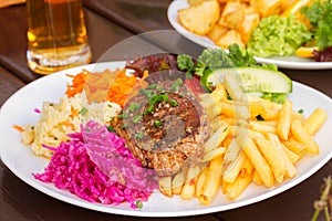 Plate of meat steak with garnish