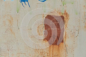 Plate of metal with big rust spot texture traces of paint faint color corroded with age in Sofia, Bulgaria, Eastern