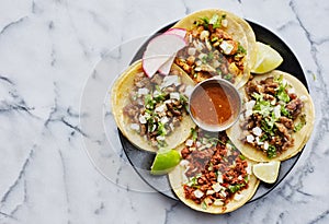 Plate of mexican street tacos in copy space composition photo
