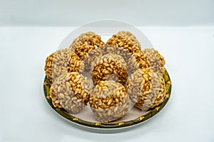 A plate of Murmura Murai Ladoo Puffed Rice in Jaggery Balls Maghe Makar Sankranti Festival