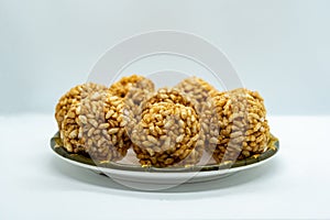 A plate of Murmura Murai Ladoo Puffed Rice in Jaggery Balls Maghe Makar Sankranti Festival