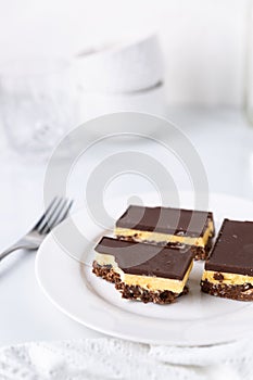 A plate with Nanaimo bars - a traditional Canadian dessert