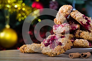 Plate of oat cookies with cinnamon sticks