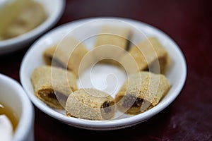 A plate of old Beijing traditional dessert snacks, donkey rolling