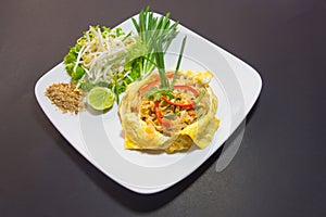 Plate of Pad Thai or phat Thai in omelette