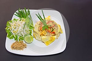 Plate of Pad Thai or phat Thai in omelette