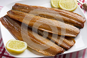 Plate with pair of kippers, smoked herring photo