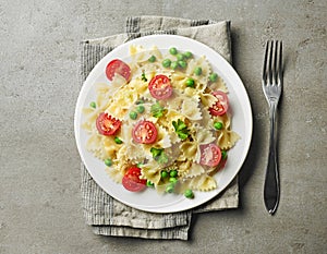 Plate of pasta with cheese and vegetables