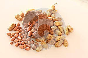 Plate with peanut on black background,Peanut pods in a bowl and peanuts,Bowl of organic roasted peanuts in shell,raw peanuts are