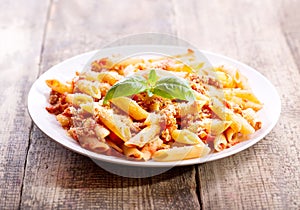 Plate of penne pasta bolognese