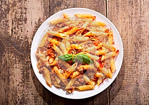Plate of penne pasta bolognese