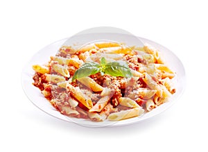 Plate of penne pasta bolognese on white background