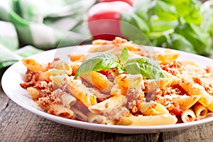 Plate of penne pasta bolognese