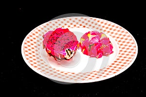 A plate with a piece of fruit on it