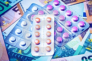 Plate with pills on the background of euro bills. The concept of the expensive cost of healthcare