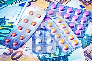 Plate with pills on the background of euro bills. The concept of the expensive cost of healthcare