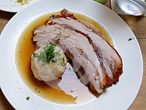 Plate of pork with bread dumpling