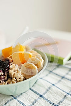 Plate with porridge on the table with notepad