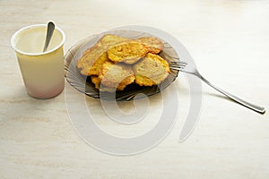 Plate of potato pancakes on the table