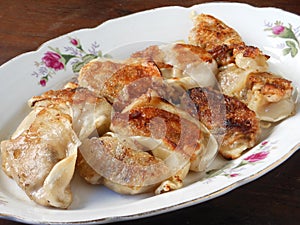 A plate of potstickers