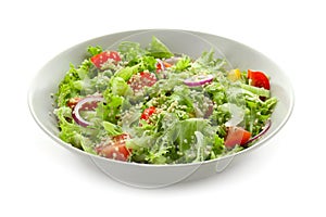 Plate with quinoa salad on white background