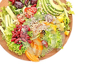 Plate with quinoa salad on white background, top view