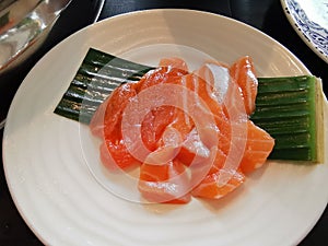 A plate of raw sashimi fish salmon