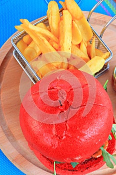 Plate of red hamburger and fries