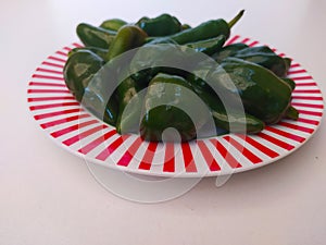 A plate of cheli green peppers photo