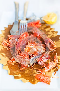 Plate with the remains of seafood after lunch