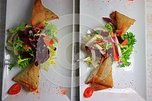 Plate of samoussa and lettuce salad