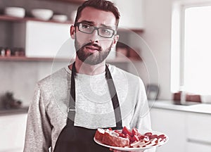 Plate of sandwiches in the hands of an attractive man