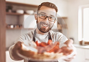 Plate of sandwiches in the hands of an attractive man