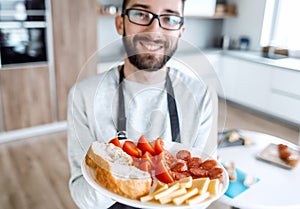 Plate of sandwiches in the hands of an attractive man