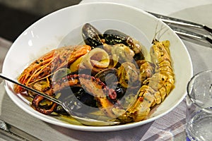 Plate with seafood in traditional restaurant in Italy