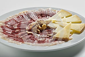 Plate of Serrano ham and manchego cheese