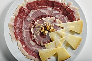 Plate of Serrano ham and manchego cheese