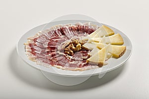 Plate of Serrano ham and manchego cheese