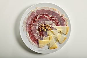 Plate of Serrano ham and manchego cheese