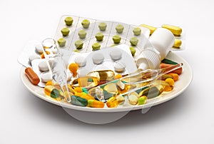 Plate with set of pills, tablets, vitamins, drugs, omega 3 fish oil, gel capsules, medicament and food supplement for health care