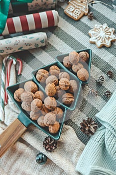 Plate in the shape of a Christmas tree with nuts, background