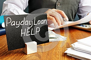 Plate with sign Payday loan help.