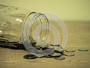 Plate and silverwear including spoon and fork on wood background