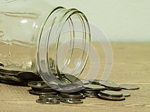 Plate and silverwear including spoon and fork on wood background