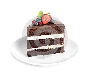 Plate with slice of chocolate sponge berry cake