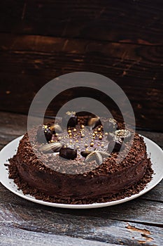 Plate with slice of tasty homemade chocolate cake on table